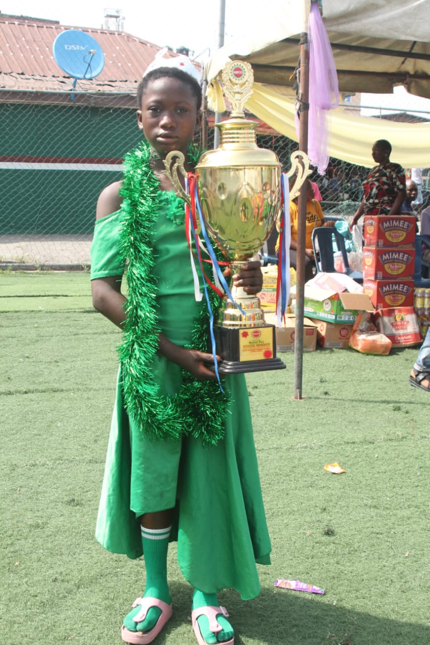 Child with trophy at NIPCO-sponsored festival