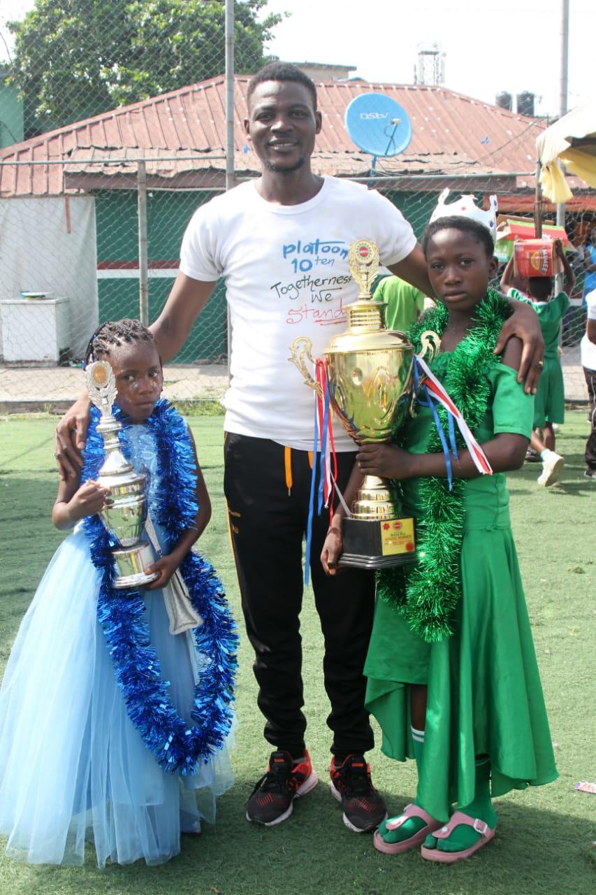 Children receiving trophies at NIPCO-sponsored festival